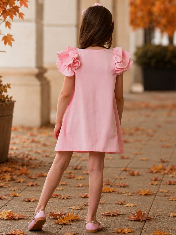 Girls pink dress with layered ruffle sleeves.