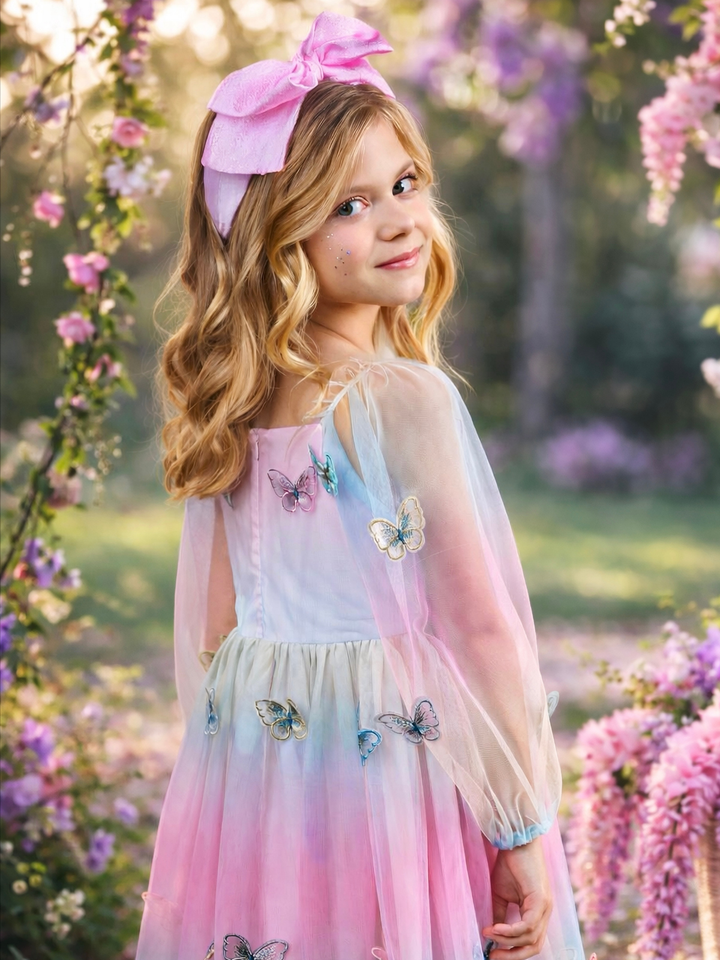 Back view of girls butterfly dress with pastel tulle and sheer sleeves