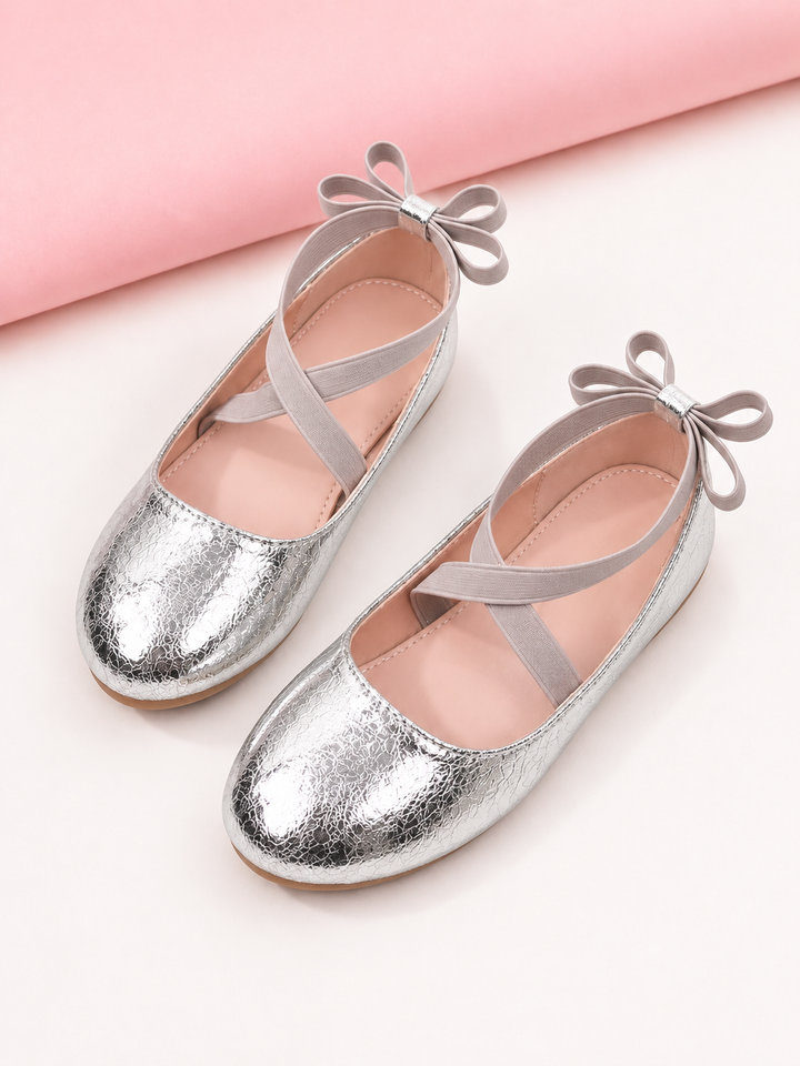 Girls silver metallic ballet flats with crisscross straps and bow details
