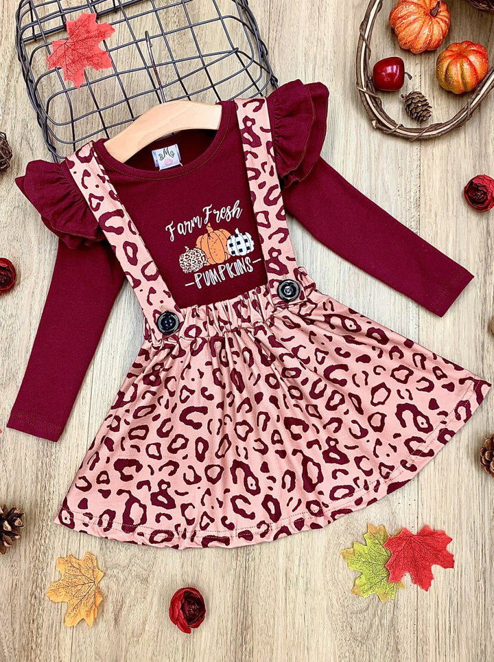Little girls Fall long-sleeved "Farm Fresh Pumpkins" graphic top with ruffle shoulder accents and leopard print pinafore skirt - Mia Belle Girls
