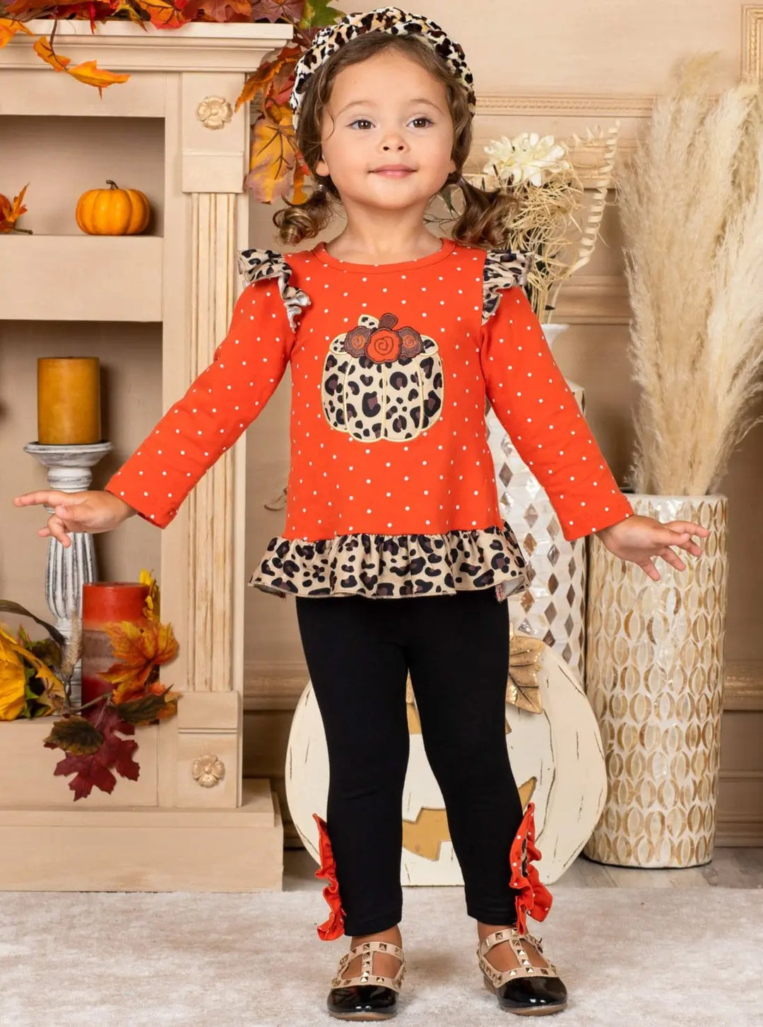 Little girls Fall long-sleeve polka dot tunic with leopard print pumpkin applique, leopard ruffle accents on shoulder and hem, and black leggings with matching ruffle button ankle accents - Mia Belle Girls