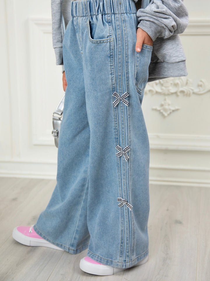 Girls light wash wide leg jeans with pearl bow embellishments