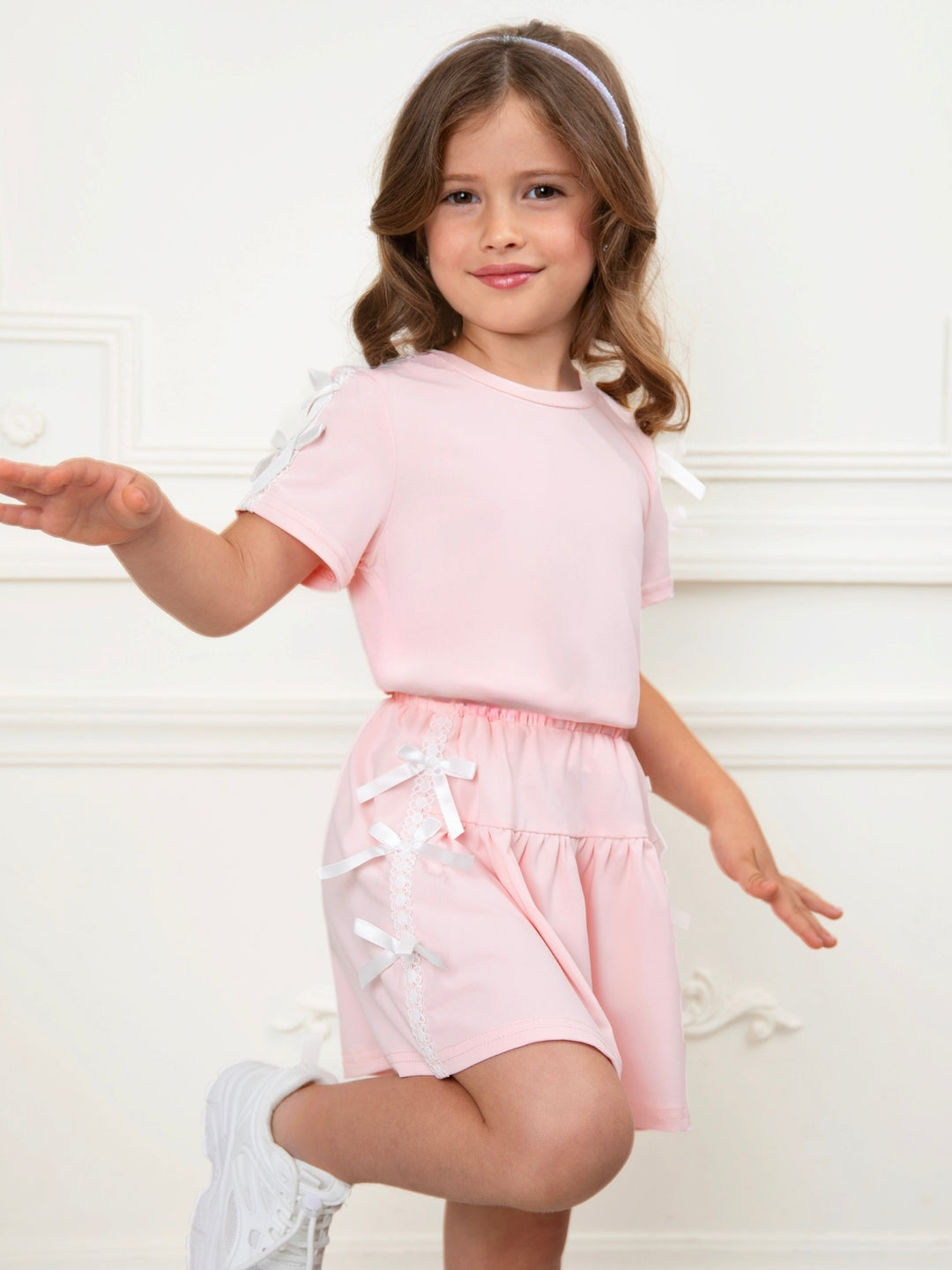 Pink girls outfit with short sleeve top and pleated skirt