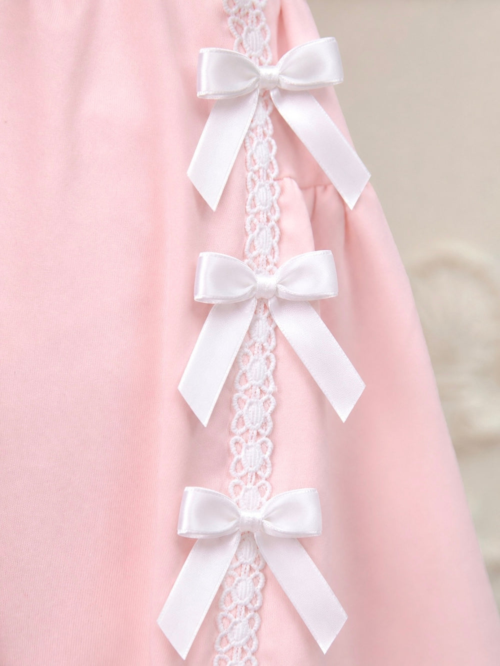 Girls matching skirt set featuring lace ribbon bow accents
