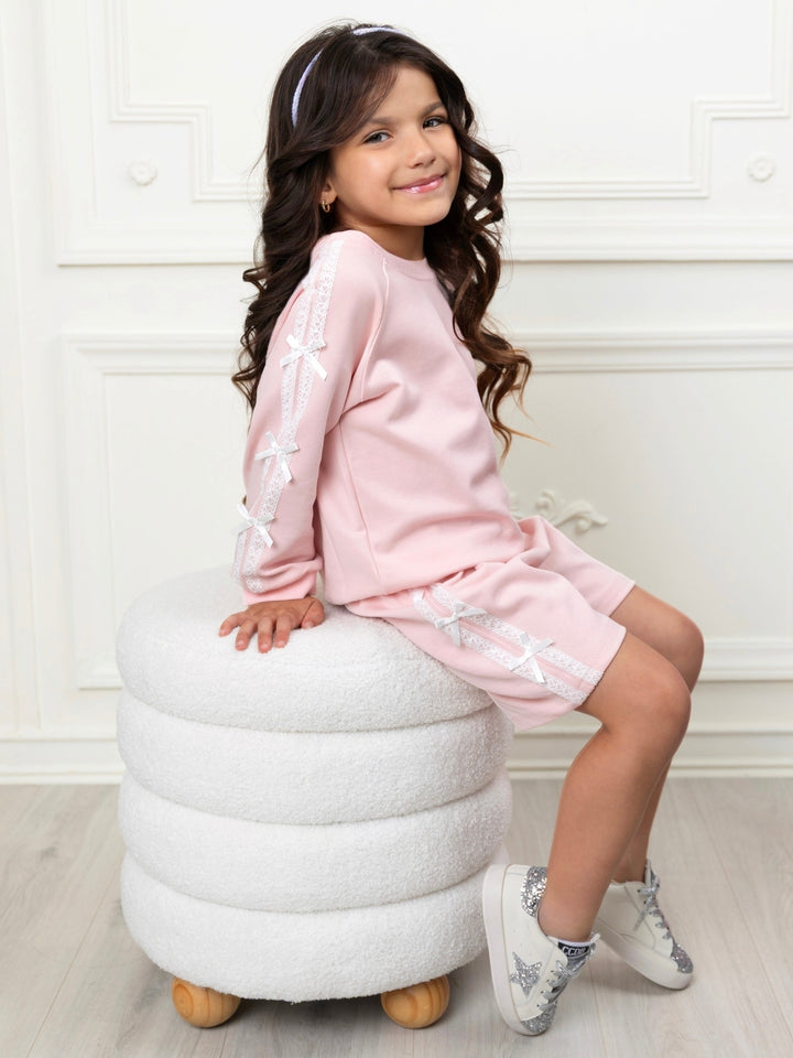 Pink girls matching outfit featuring lace trim and ribbon bows