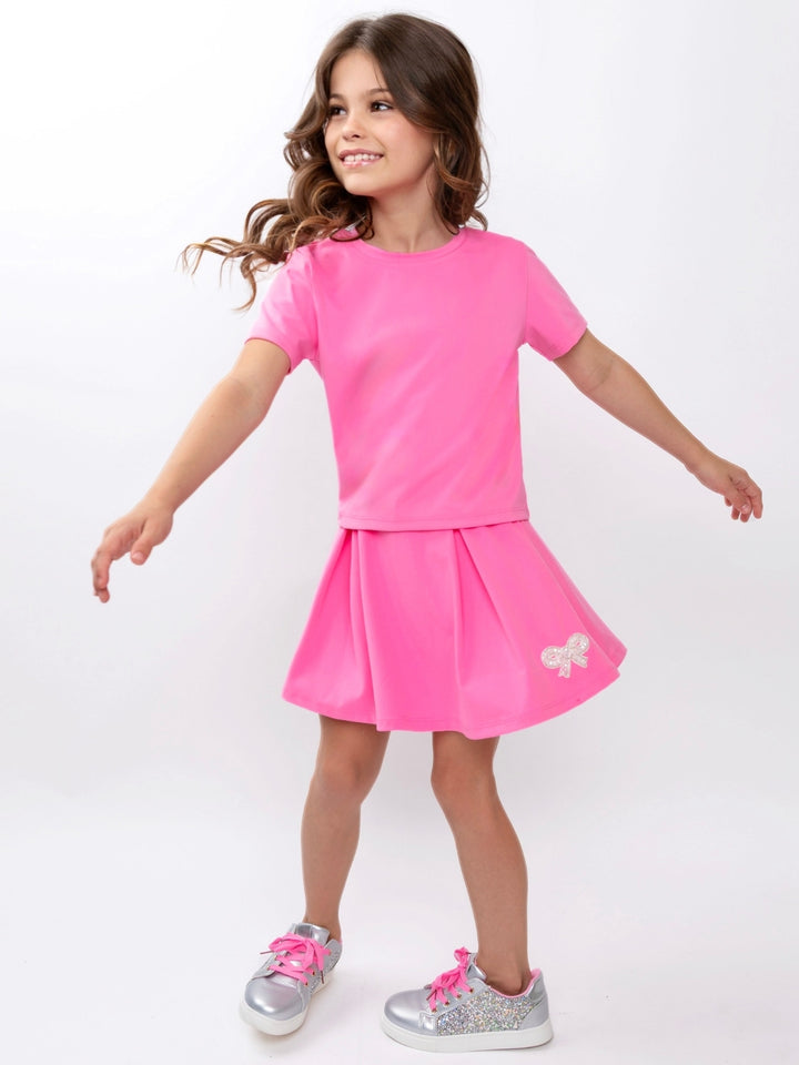 Stylish girls summer activewear outfit with pleated skirt
