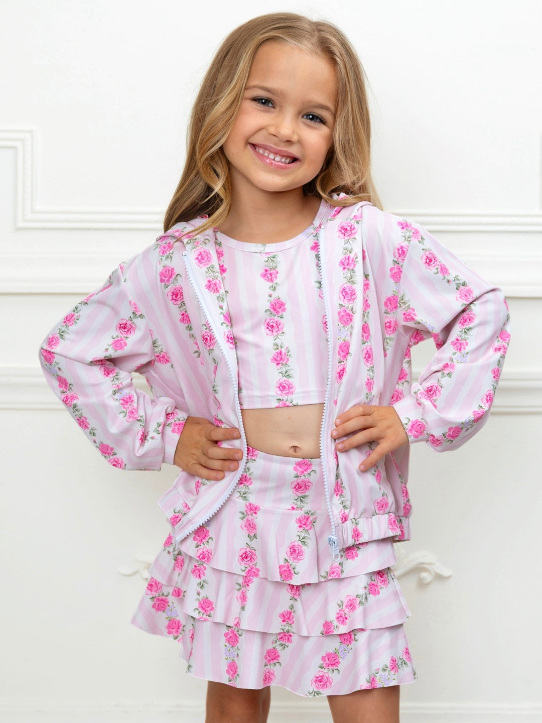 Pink floral girls outfit with zip front hoodie and ruffle skort