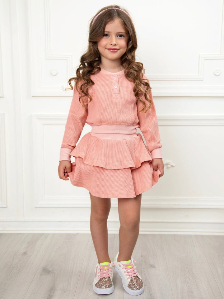 Girls school outfit featuring waffle knit texture and ruffles