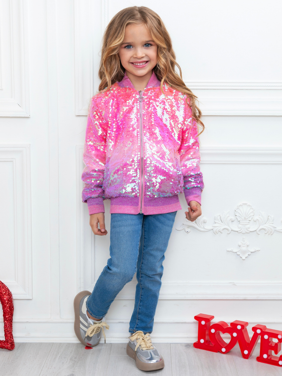 Girls glitter pink sequin jacket styled with jeans