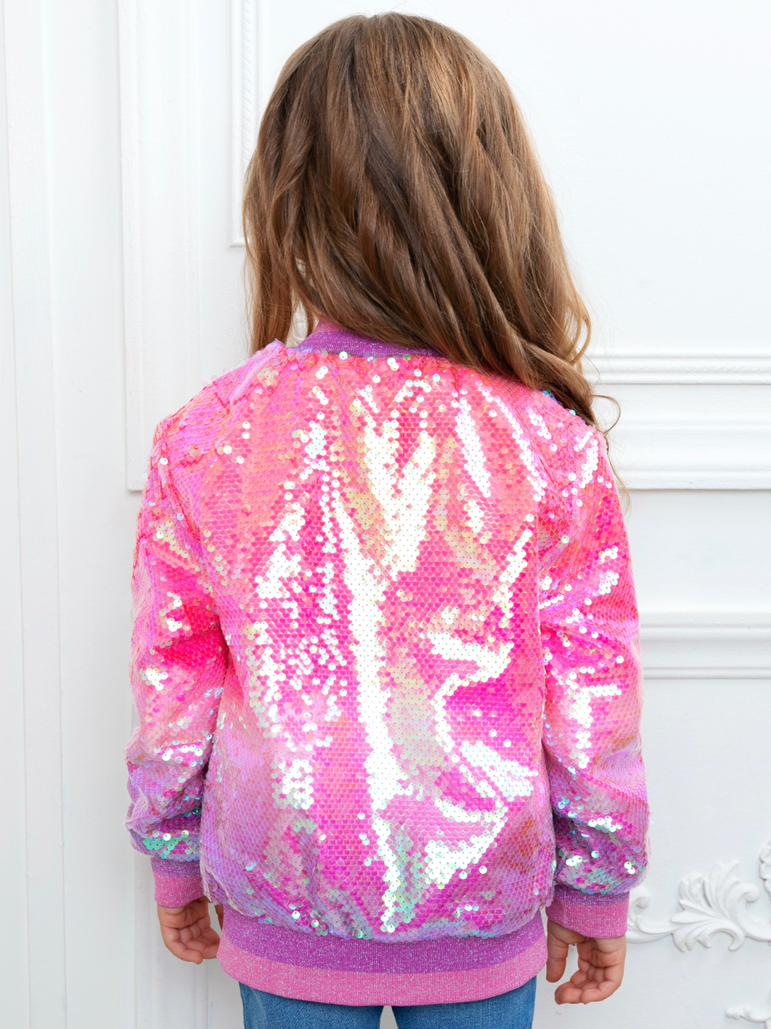 Little girl wearing pink sequin bomber jacket for birthday party outfit
