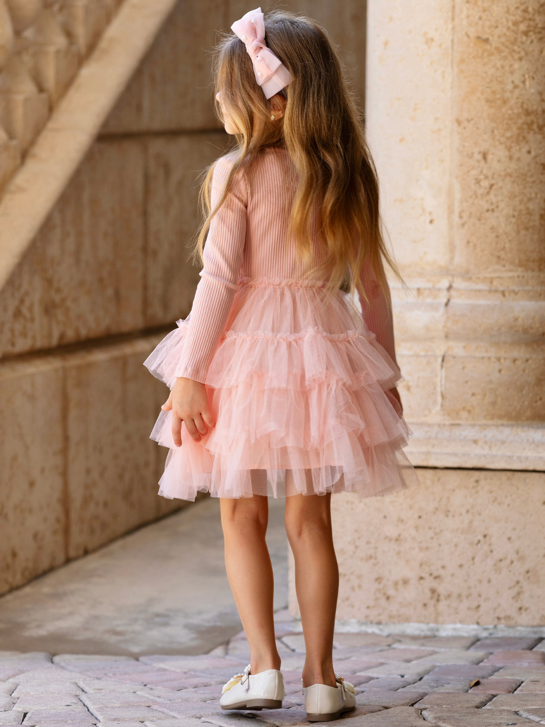 Girls blush pink twirl dress with a soft ribbed bodice and tiered tulle skirt for family photos, holidays, and special occasions.