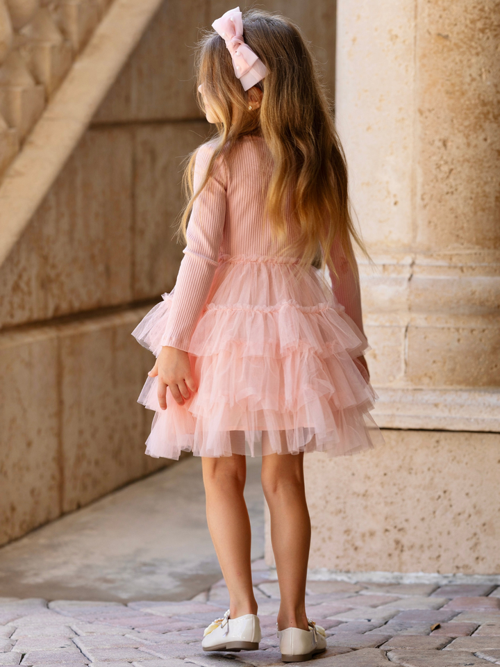 Girls blush pink twirl dress with a soft ribbed bodice and tiered tulle skirt for family photos, holidays, and special occasions.