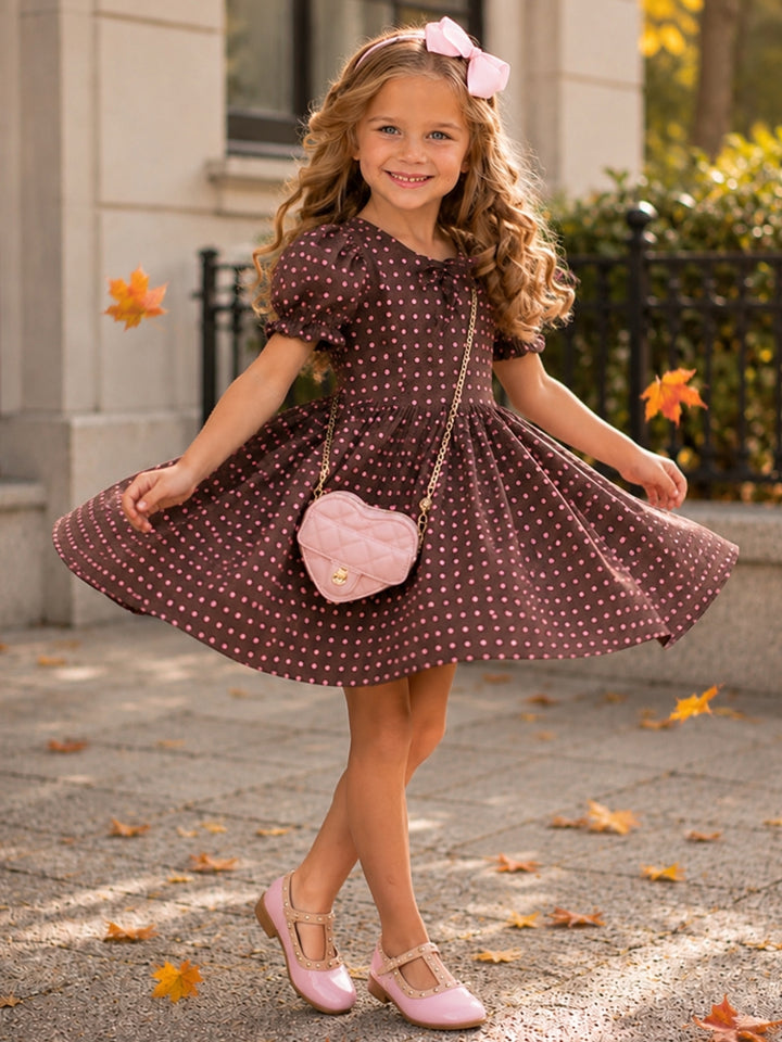 Girls brown fall dress with blush pink polka dots and bow neckline.
