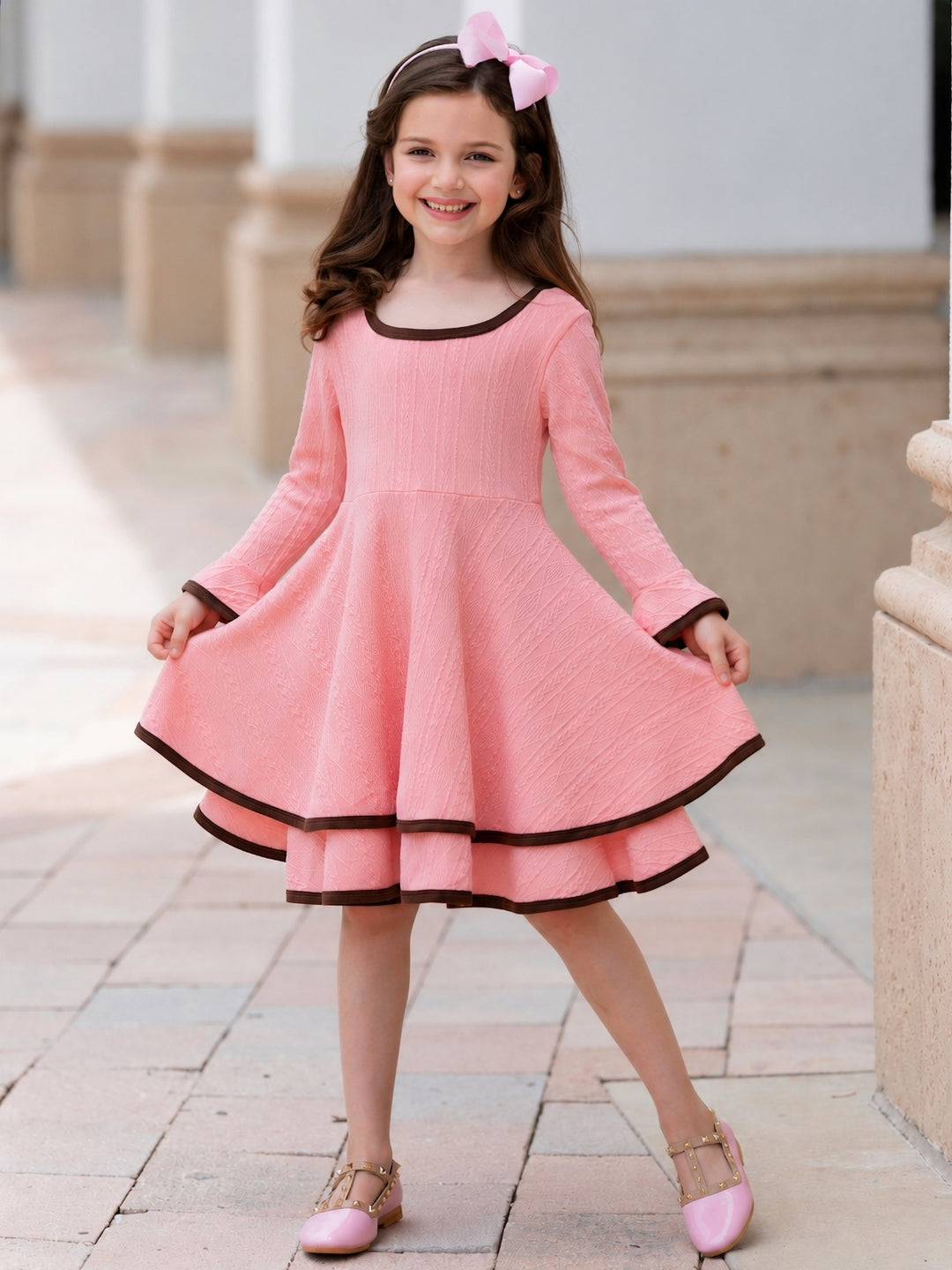 Girls pink twirl dress with contrast hem detail.
