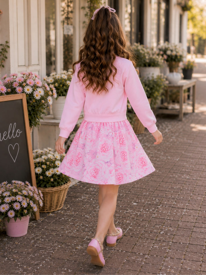 Girls blush floral dress with long sleeves and twirl silhouette.