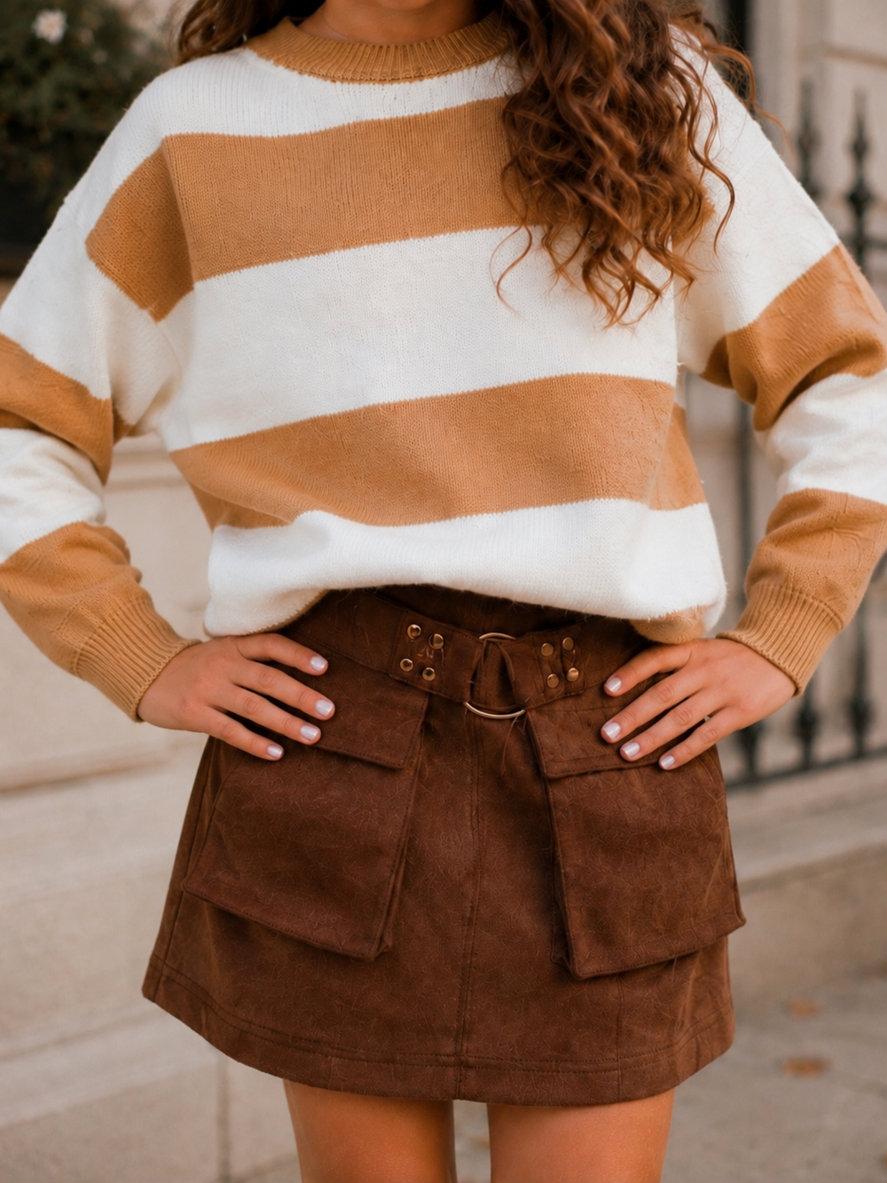 Girls outfit with cargo skirt and knit sweater.