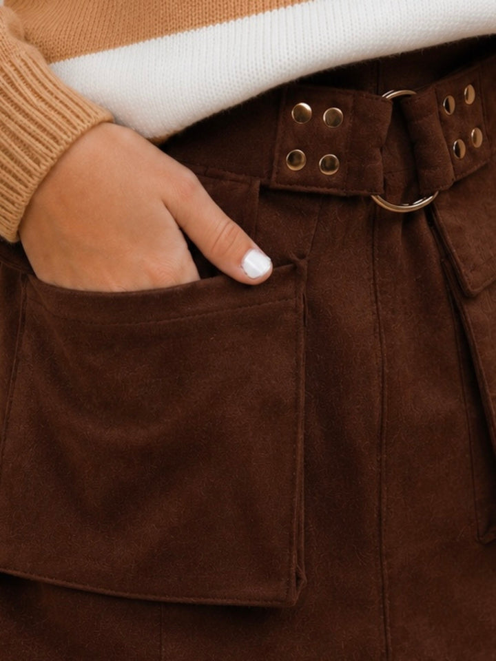 Girls autumn outfit with cargo skort and knit sweater.