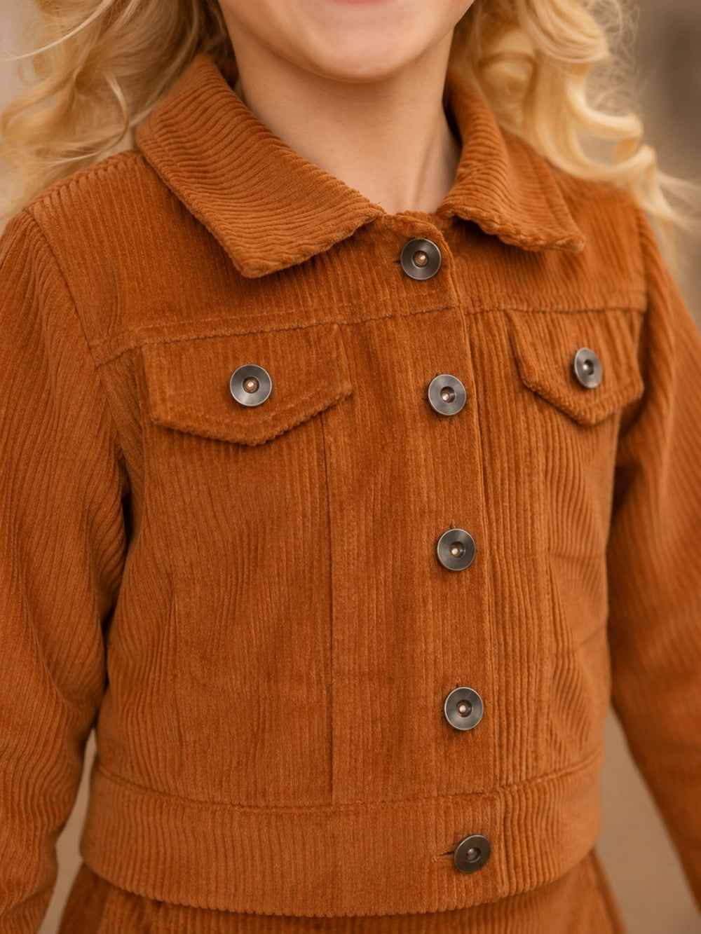 Girls button-front corduroy jacket with coordinating skirt.