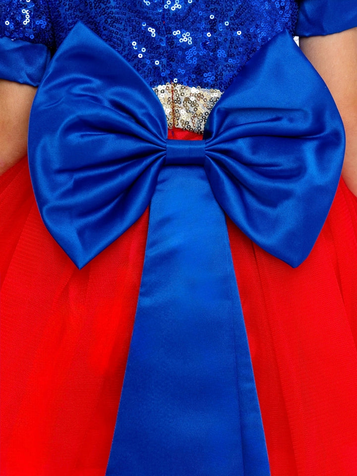 Cute girls Halloween costume with a sparkling blue bodice, red tulle skirt, and blue bow.