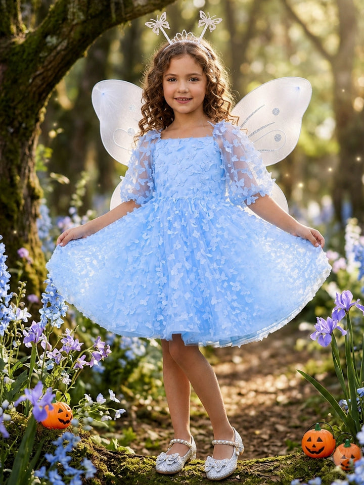 Girls blue fairy costume featuring a whimsical butterfly dress for Halloween and dress-up.