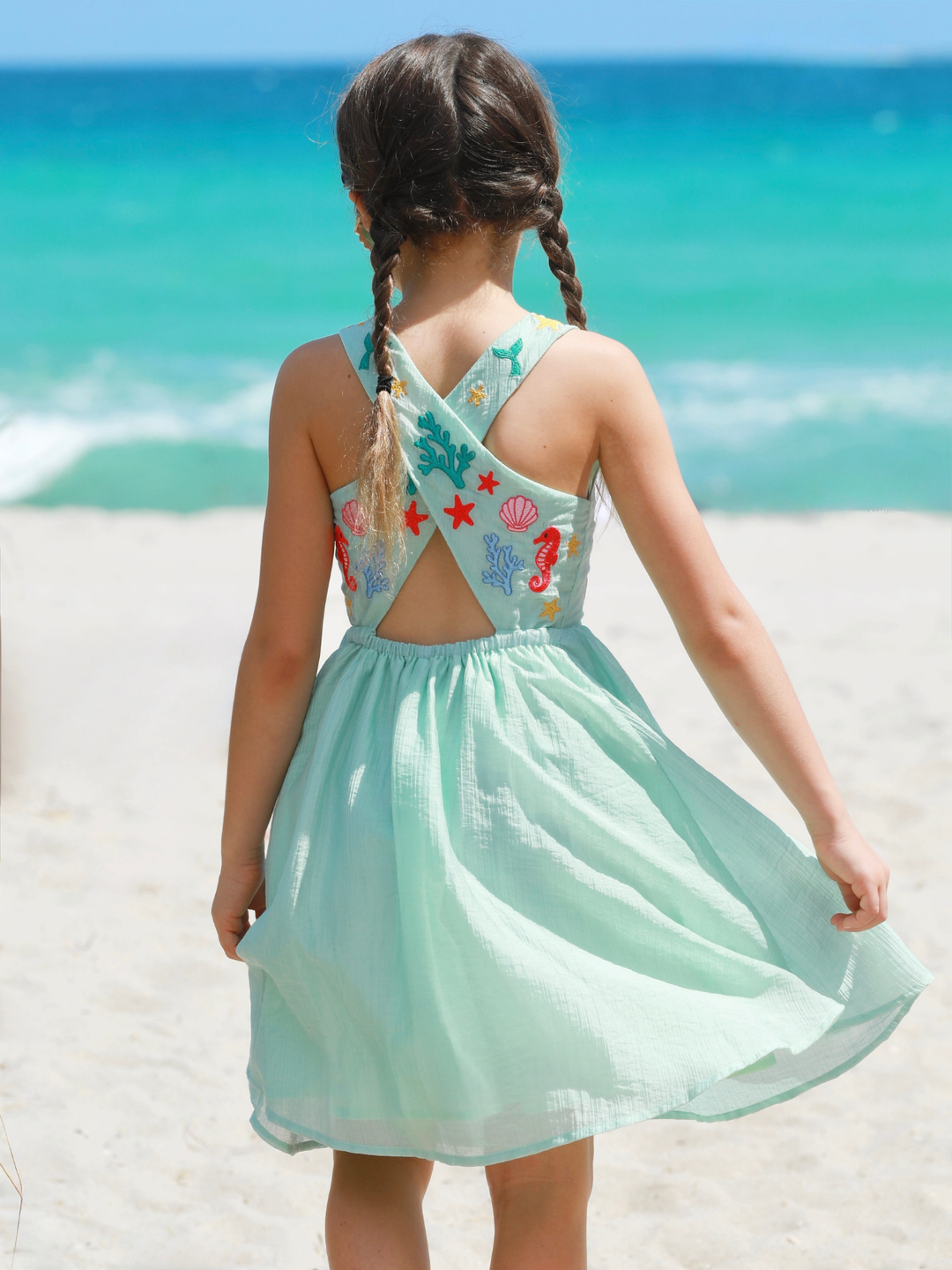 girl wearing aqua beach dress with sea life embroidery summer dress