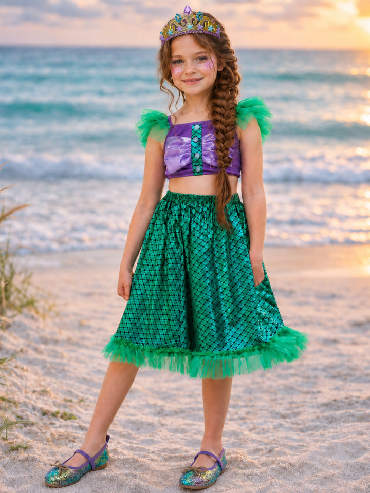 Mermaid princess costume for girls featuring a seashell-inspired top and scale-print skirt.