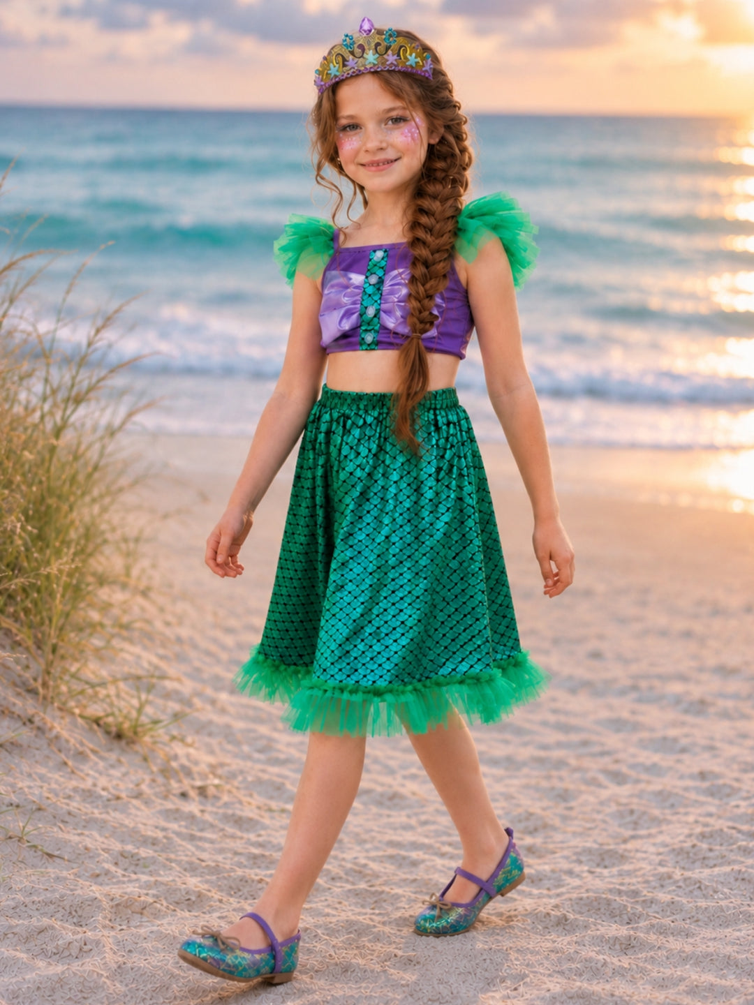 Girl wearing a Mermaid Princess Halloween costume with a shimmering two-piece outfit.