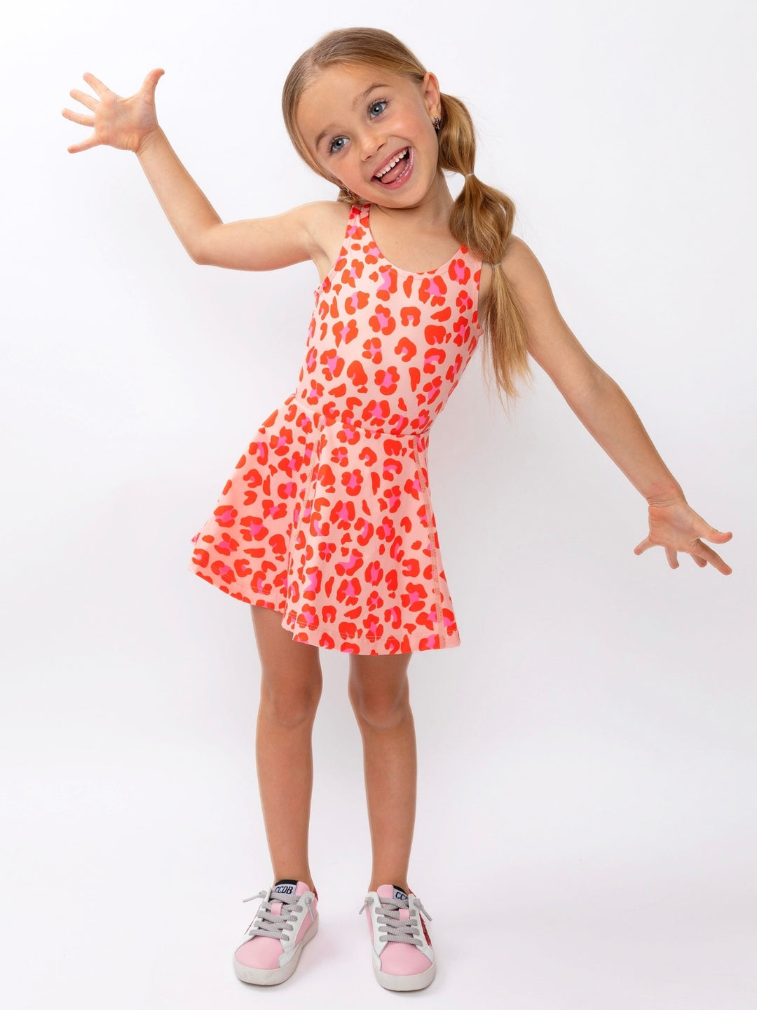Girls pink activewear dress with flowy skirt silhouette