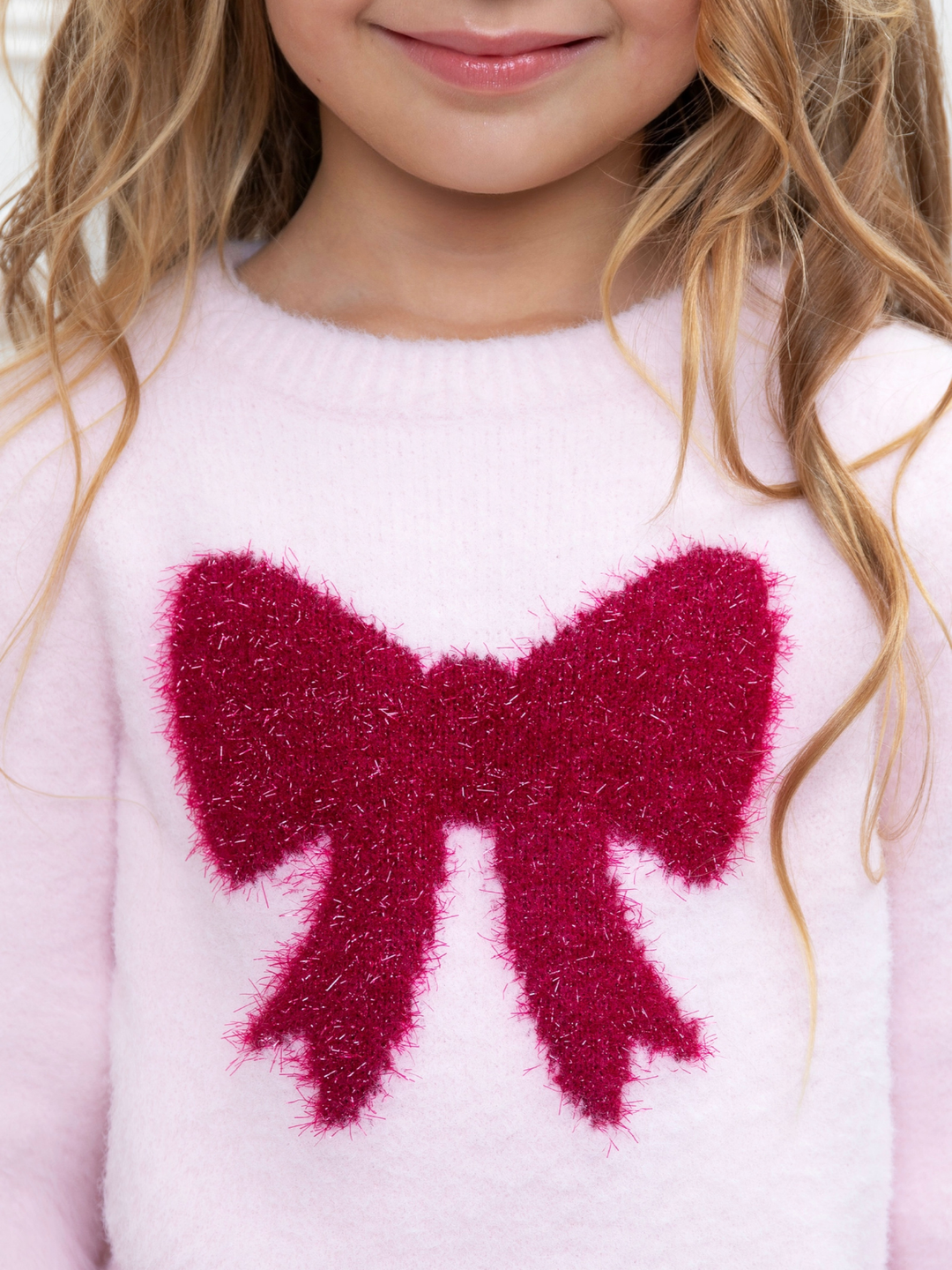 Cute girls knit sweater with fuzzy bow detail