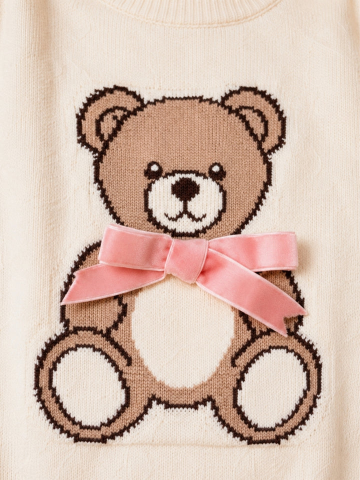 Girls holiday sweater with teddy bear applique.