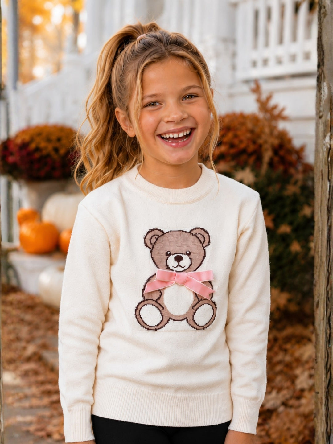 Girls ivory sweater with cute teddy bear design.